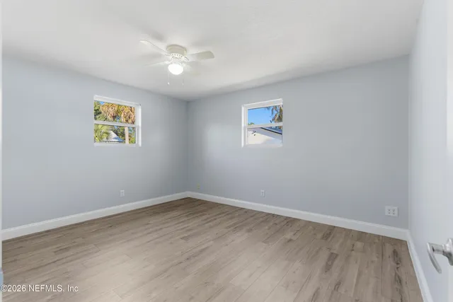 a view of room with window and ceiling fan