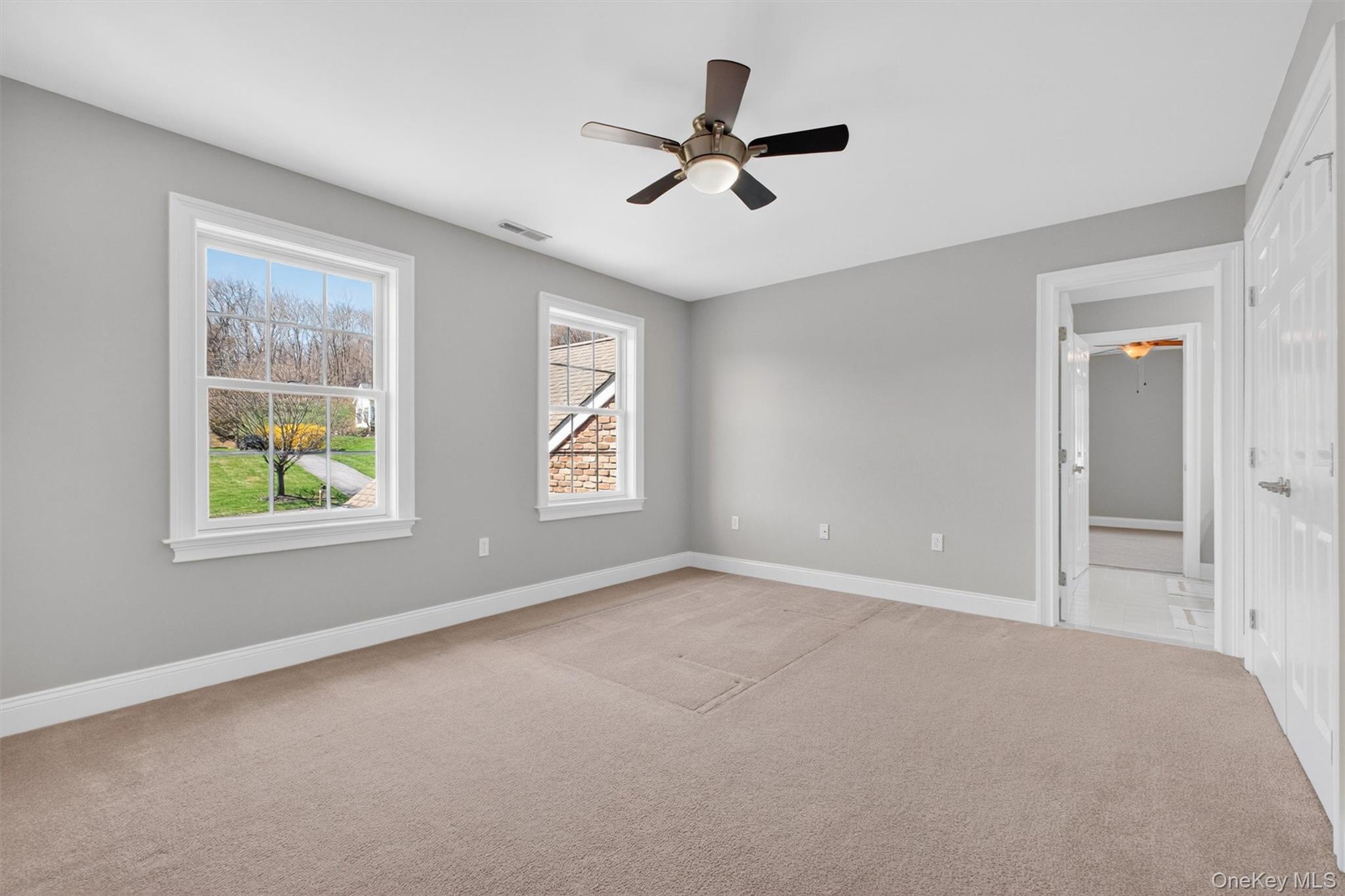 196 Country Club Road Hopewell Junction, NY 12533 - Photo 27 of 50 Opposite the primary suite and perfectly positioned at the top of the stairs, Bedroom #4 is a spacious 14' x 12' retreat that enjoys both privacy and convenience. Filled with natural light and generous proportions, this inviting bedroom flows seamlessly from the upper-level hallway into a beautifully connected Jack-and-Jill bath, creating an ideal setup for family or guests. Thoughtfully located and generously sized, this room offers the perfect combination of comfort, function, and flexibility