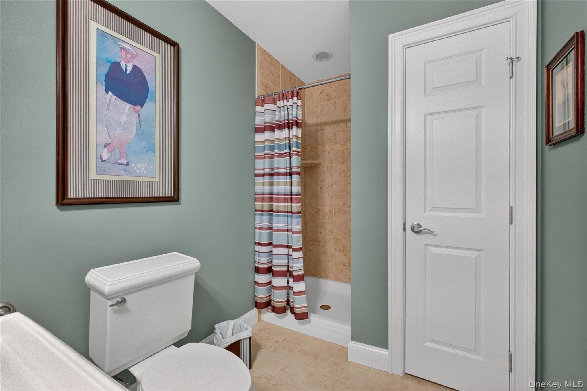 196 Country Club Road Hopewell Junction, NY 12533 - Photo 34 of 50 The basement’s full bathroom—one of four in the home—offers both style and convenience, thoughtfully designed to complement the lower level’s versatility. It features a spacious 5-foot custom tiled shower with sleek Kohler fixtures, along with a pedestal sink and coordinating toilet for a clean, timeless look. Beautifully finished and highly functional, this bath is ideal for overnight guests, extended family, or in-law accommodations, while also providing easy access for entertaining without the need to go upstairs. A perfect blend of comfort and practicality, it enhances the flexibility and livability of this impressive lower level.