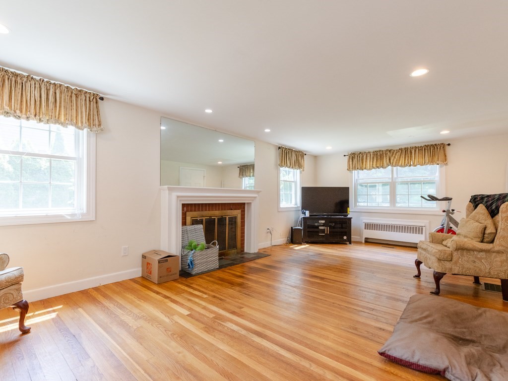 95 Blake Street Newton, MA 02460 - Photo 11 of 22 a living room with furniture and a fireplace