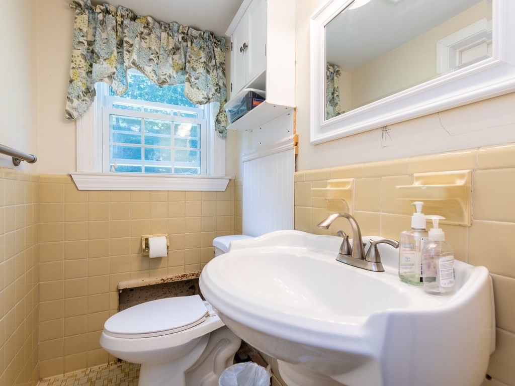 95 Blake Street Newton, MA 02460 - Photo 14 of 22 a bathroom with a sink and a toilet