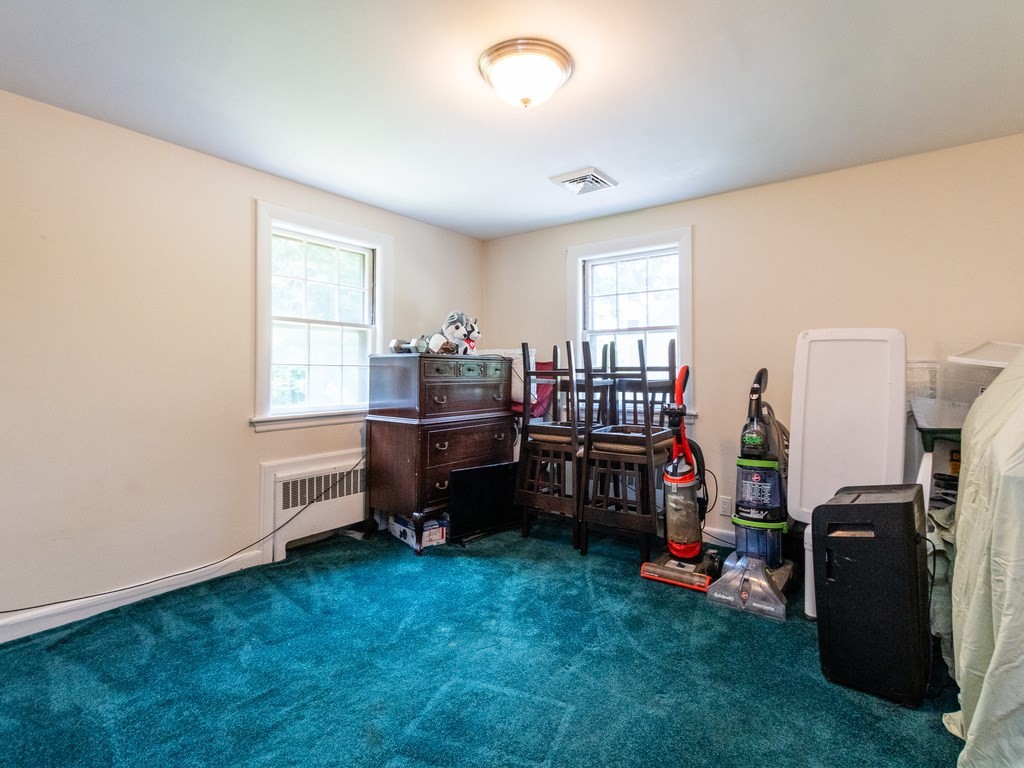 95 Blake Street Newton, MA 02460 - Photo 18 of 22 a room with furniture a window and a closet