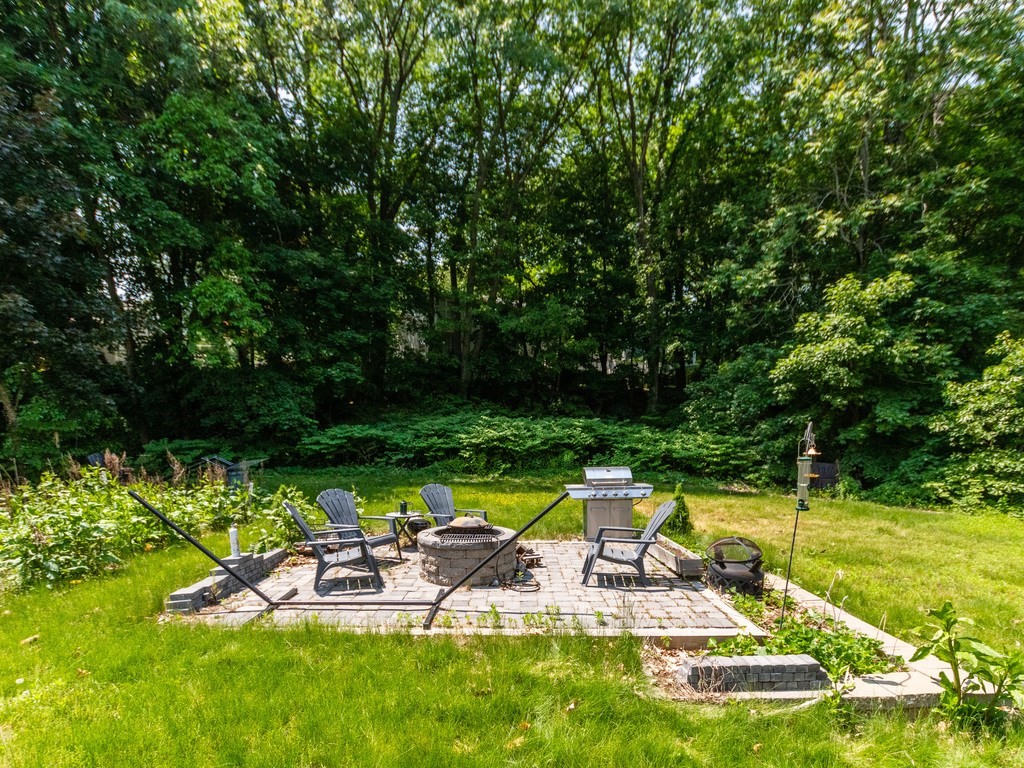 95 Blake Street Newton, MA 02460 - Photo 2 of 22 a view of swimming pool with lawn chairs and plants