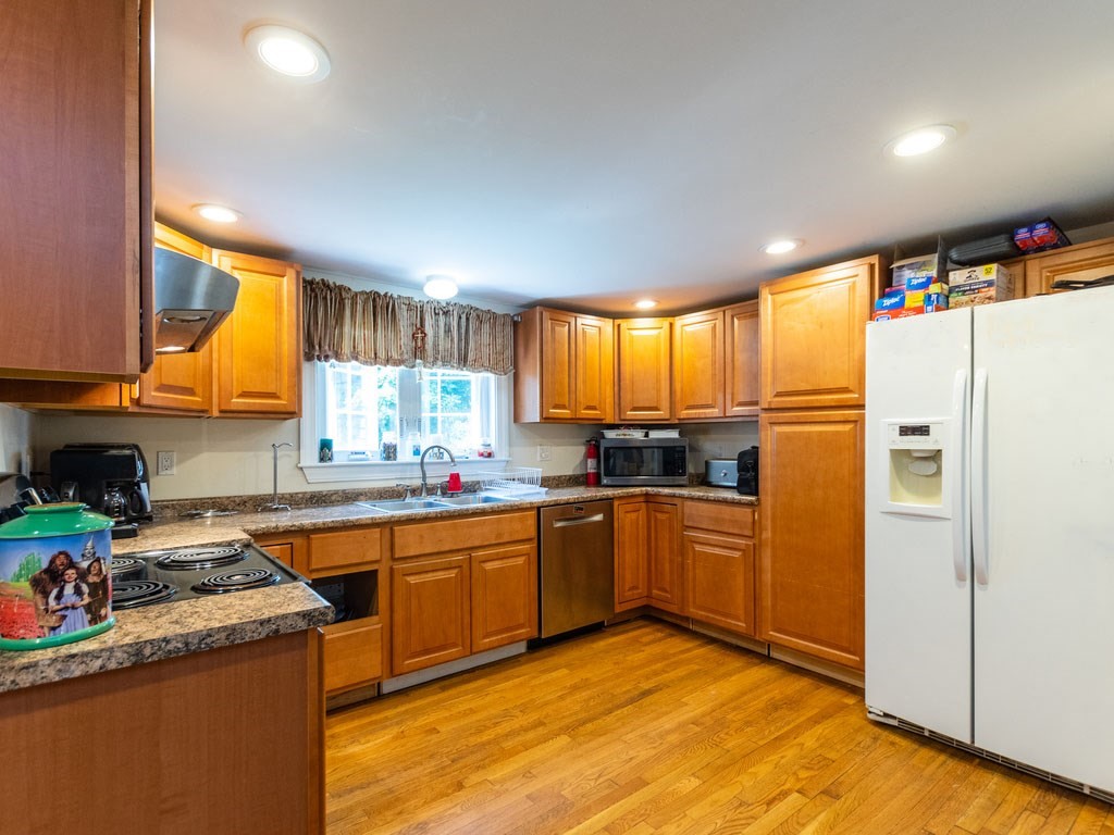 95 Blake Street Newton, MA 02460 - Photo 5 of 22 a kitchen with stainless steel appliances granite countertop refrigerator sink and cabinets