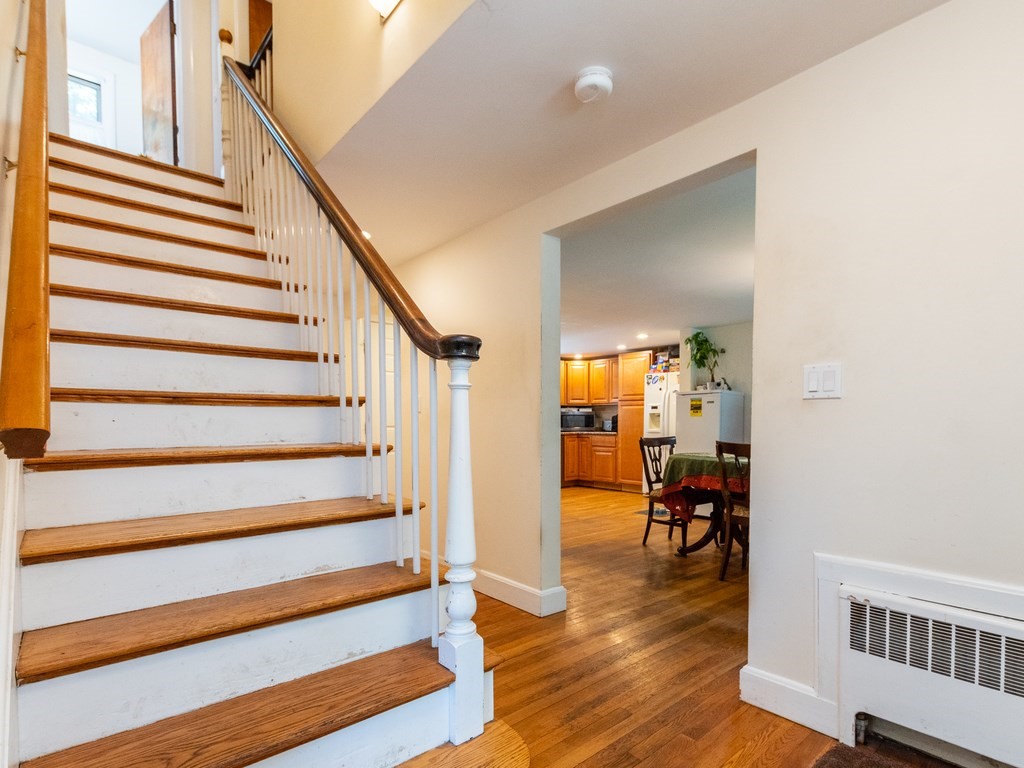 95 Blake Street Newton, MA 02460 - Photo 9 of 22 a view of entryway and hall with wooden floor