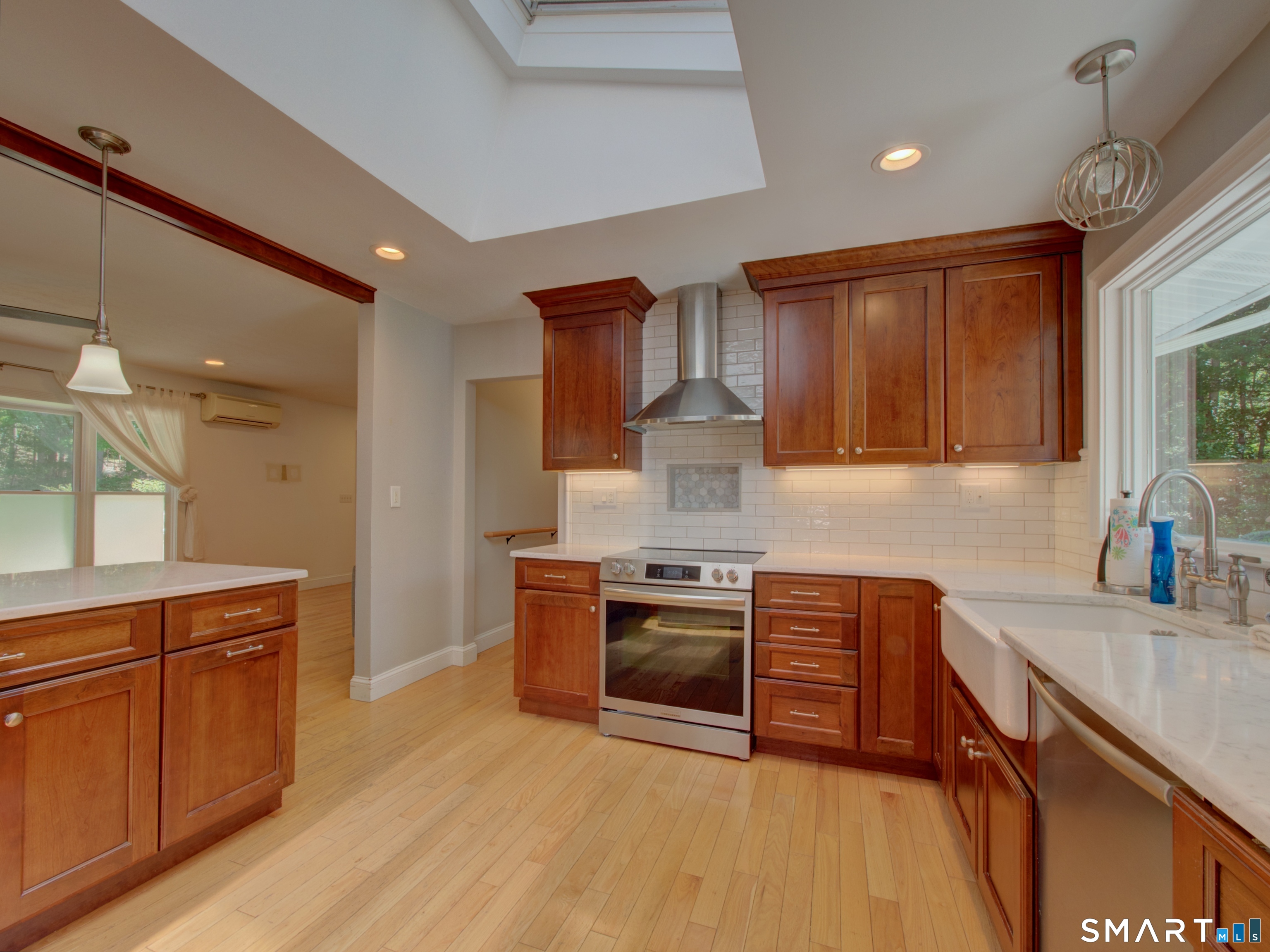 311 Sandy Hollow Road Groton, CT 06355 - Photo 2 of 26 a kitchen with stainless steel appliances granite countertop a sink stove and refrigerator