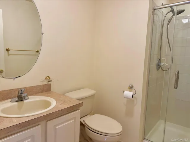 a view of a bathroom from a hallway
