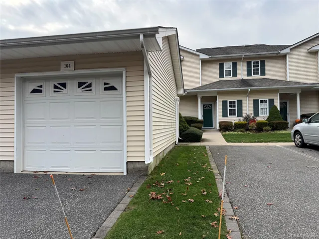 a view of a street with a sign board