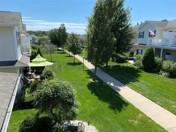 a view of a house with backyard porch and sitting area