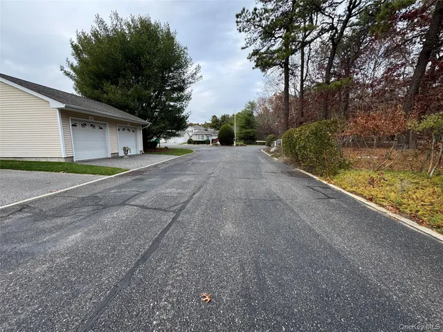 a view of a park with iron fence