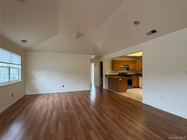 a view of a kitchen with wooden floor
