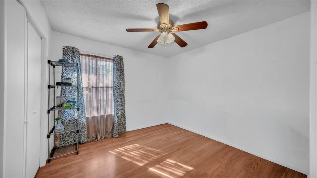 5808 Bunker Boulevard Watauga, TX 76148 - Photo 25 of 36 an empty room with closet and windows