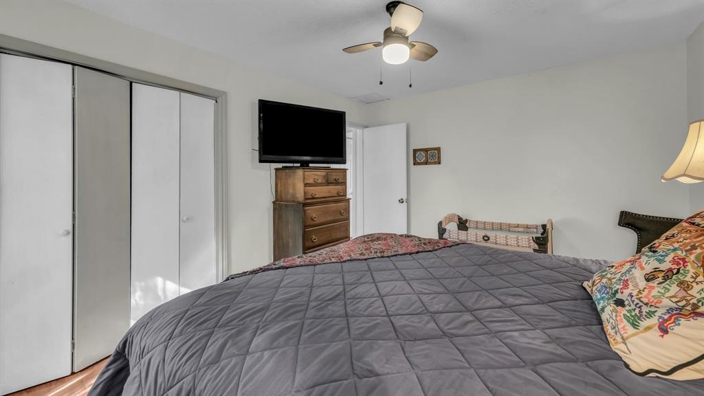 5808 Bunker Boulevard Watauga, TX 76148 - Photo 32 of 36 a bedroom with a bed and a flat screen tv