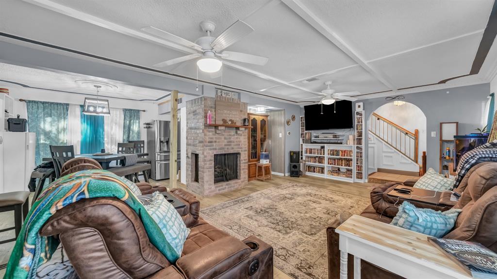 5808 Bunker Boulevard Watauga, TX 76148 - Photo 9 of 36 a living room with furniture and a flat screen tv