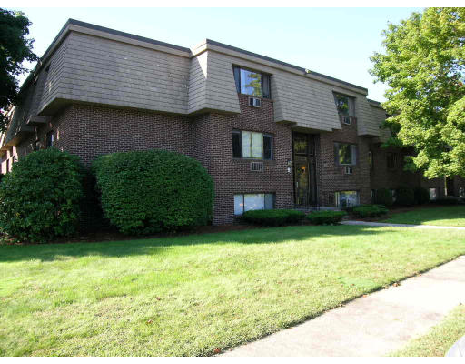 9 Hallmark Gardens, Unit 6 Burlington, MA 01803 - Photo 1 of 1 a front view of a house with garden