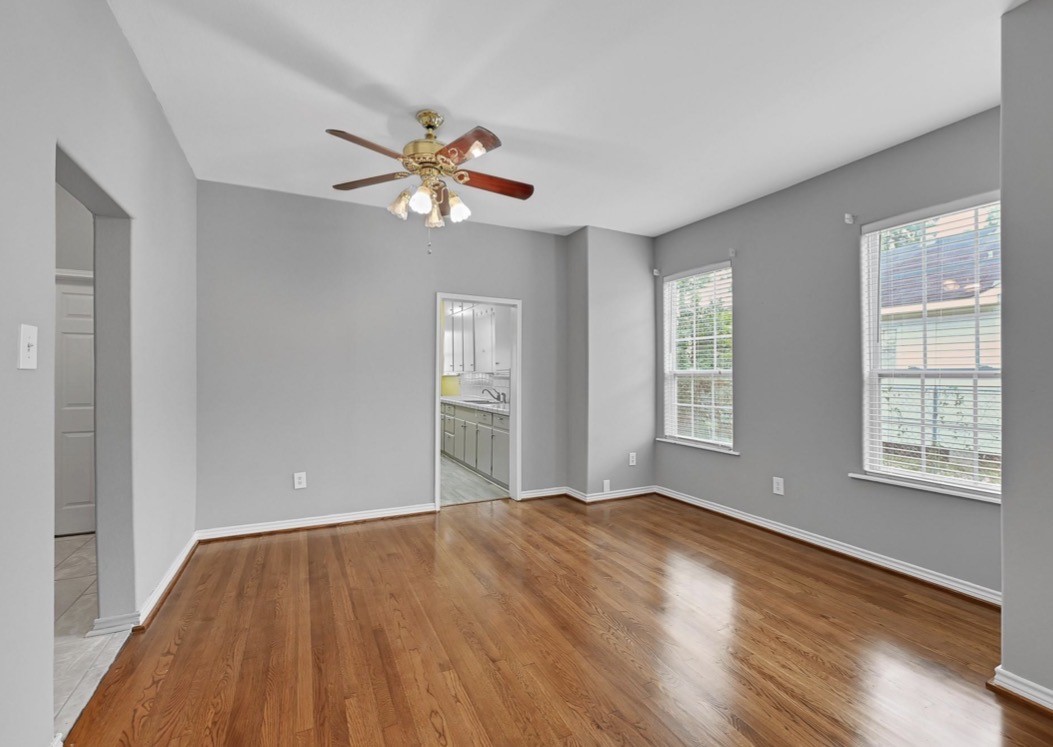 2418 Delafield Street Houston, TX 77023 - Photo 3 of 8 a view of an empty room with window and wooden floor