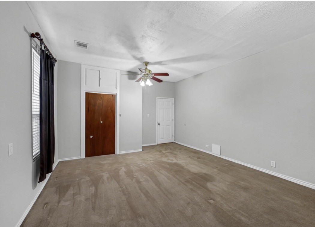 2418 Delafield Street Houston, TX 77023 - Photo 5 of 8 a view of a chandelier fan and refrigerator