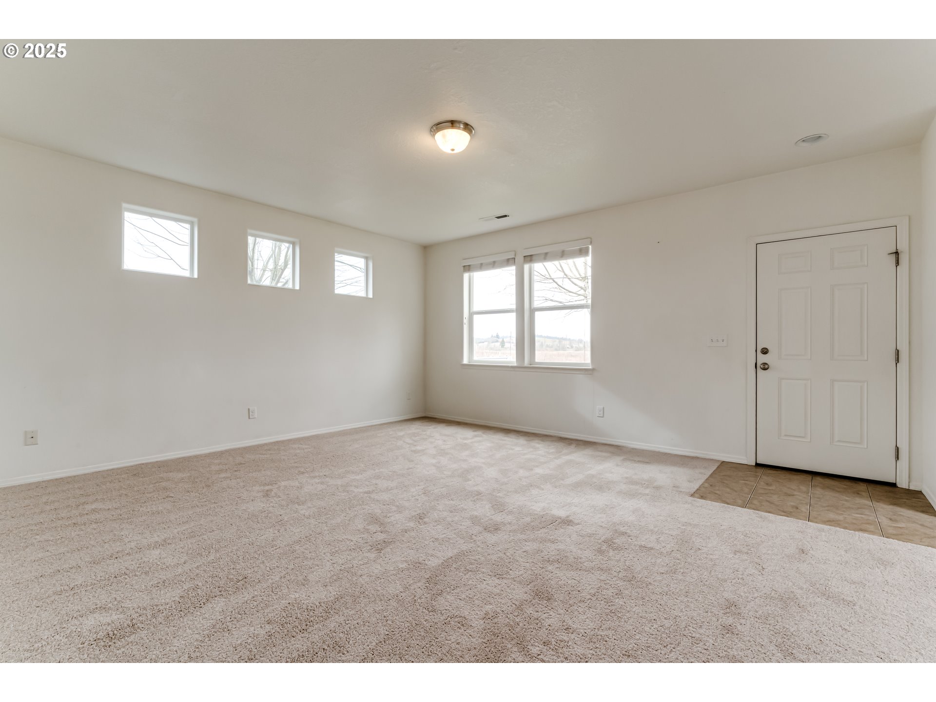1565 Legacy Street Eugene, OR 97402 - Photo 4 of 27 a view of an empty room with a window