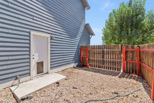 a view of a house with a wooden deck