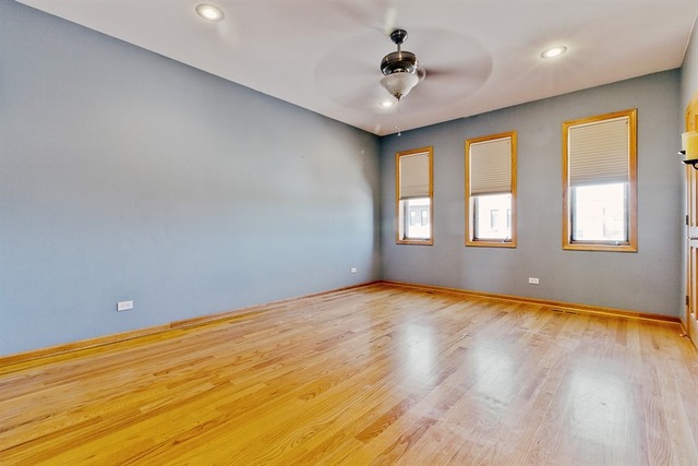 2828 South Lock Street Chicago, IL 60608 - Photo 11 of 21 a view of an empty room with window and wooden floor