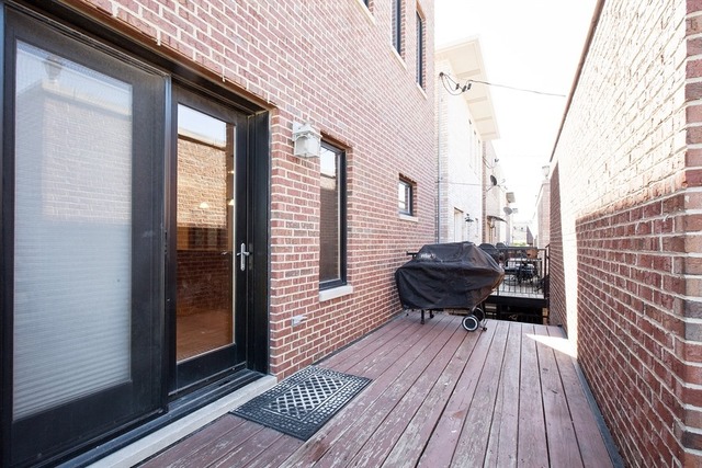 2828 South Lock Street Chicago, IL 60608 - Photo 19 of 21 a view of balcony with wooden floor and outdoor seating
