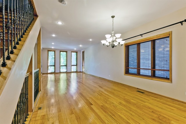 2828 South Lock Street Chicago, IL 60608 - Photo 7 of 21 a view of a room with window wooden floor and chandelier