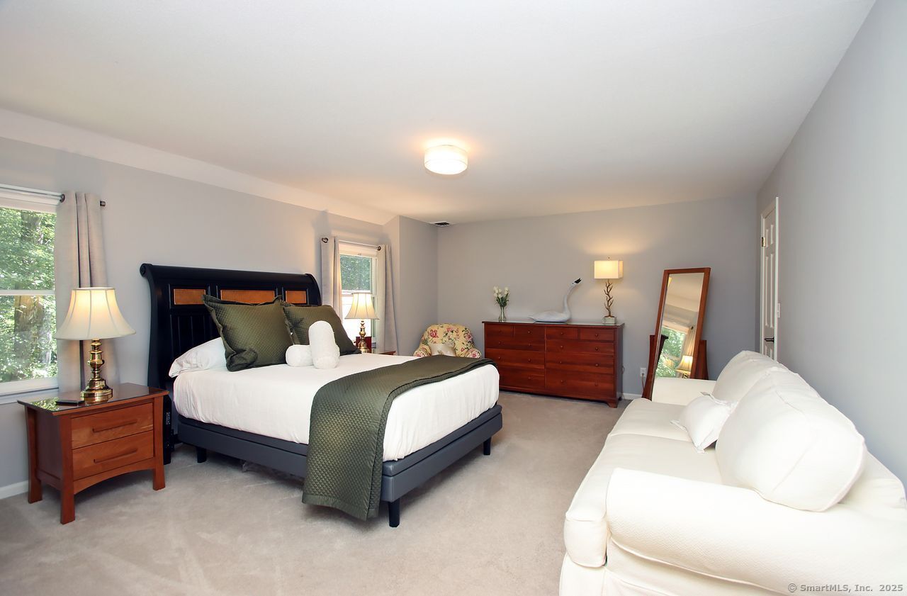 125 Wildcat Road Madison, CT 06443 - Photo 19 of 34 a bedroom with a bed and window