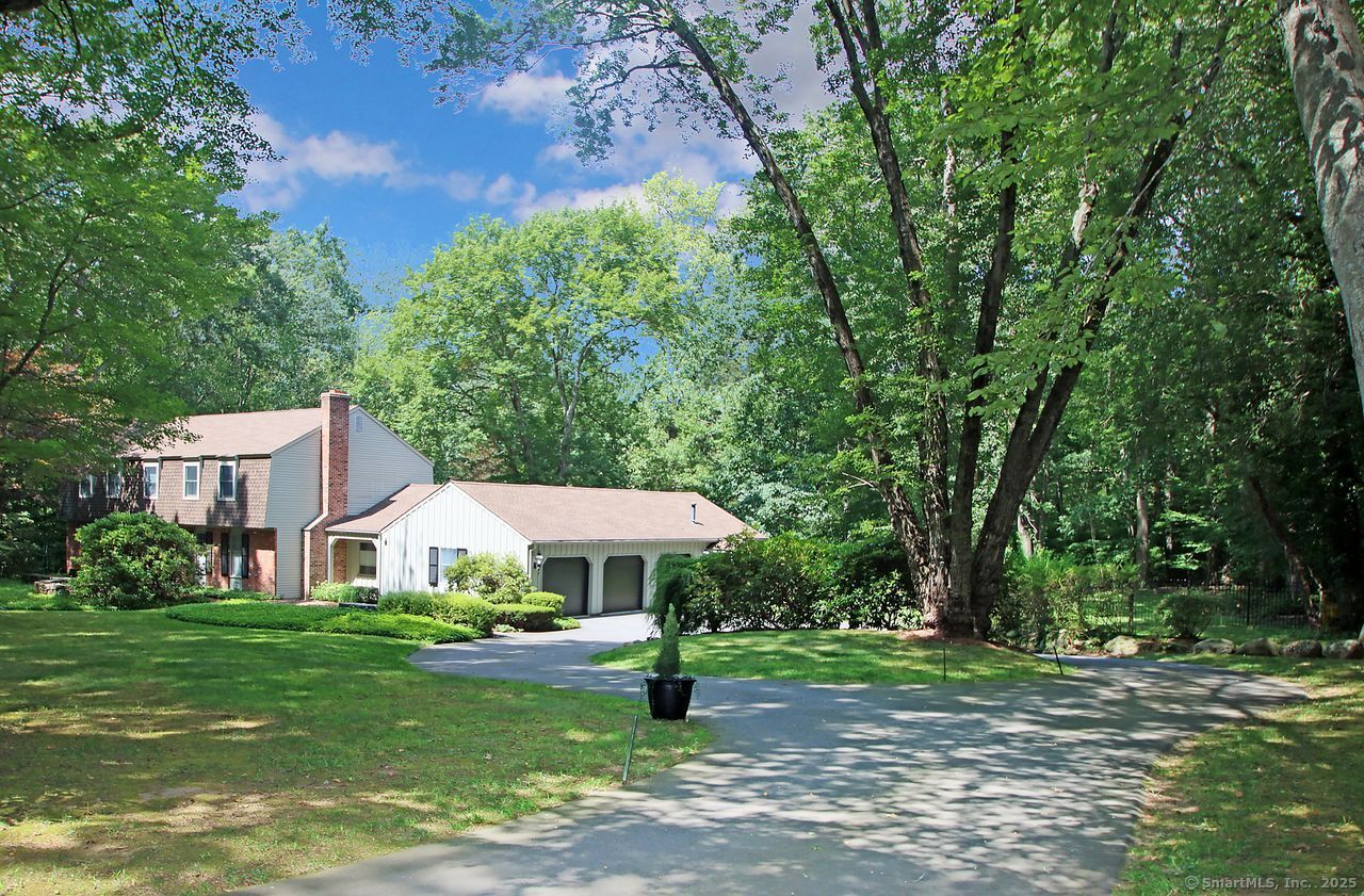 125 Wildcat Road Madison, CT 06443 - Photo 2 of 34 a view of a house with yard and sitting area
