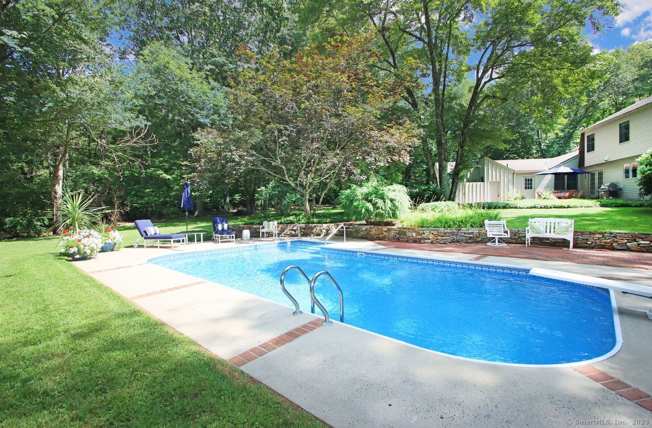 125 Wildcat Road Madison, CT 06443 - Photo 5 of 34 a view of a swimming pool with a patio