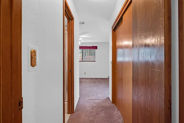 a view of an empty room with a window