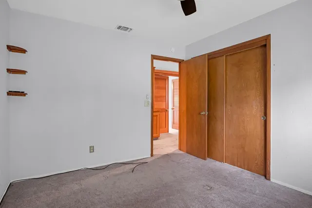 a spacious bathroom with a double vanity sink a mirror and a bathtub