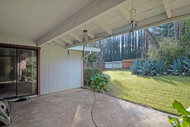 a view of a swimming pool with a yard