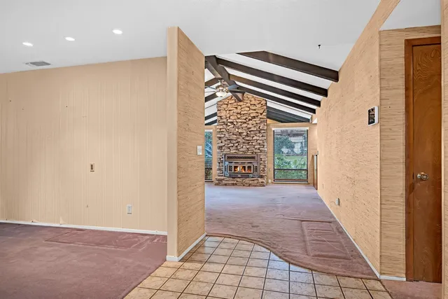 a view of an empty room and a window