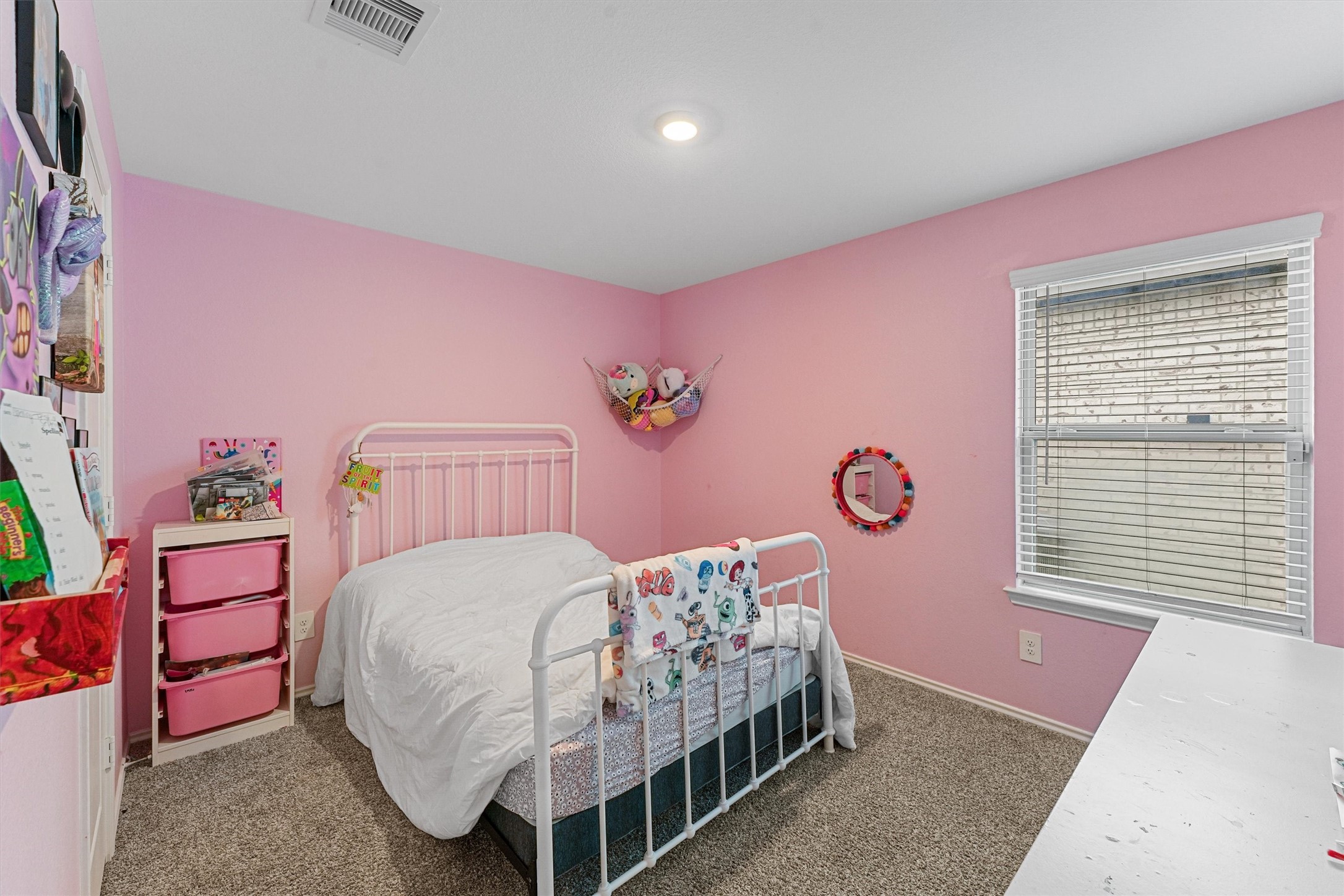 22411 Gilded Peak Lane Spring, TX 77373 - Photo 12 of 16 a bedroom with a bed and a dresser