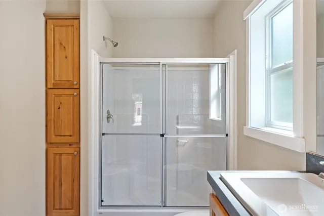 a bathroom with a tub and shower