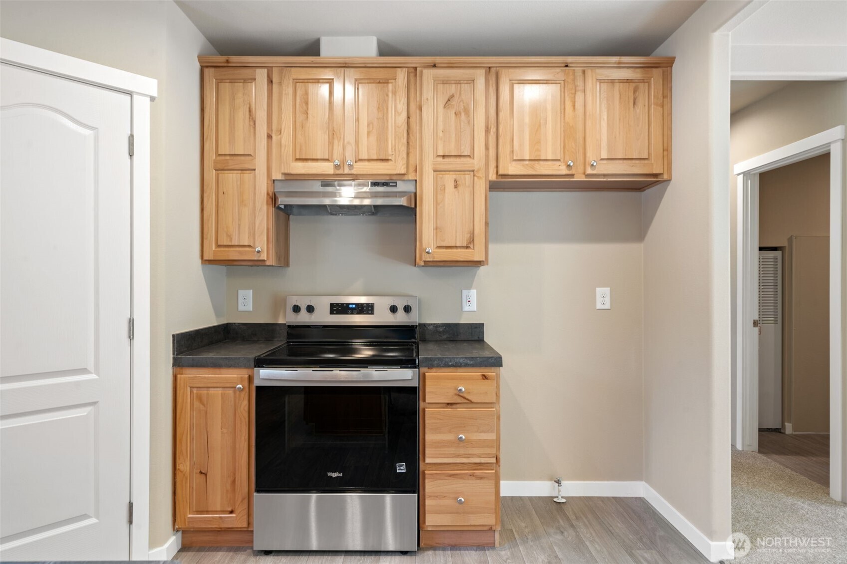 73 Butterfly Lane Sequim, WA 98382 - Photo 7 of 34 a kitchen with granite countertop a stove and a refrigerator