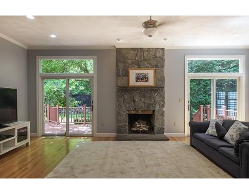 54 Bigelow Drive Sudbury, MA 01776 - Photo 13 of 40 a living room with furniture and a fireplace