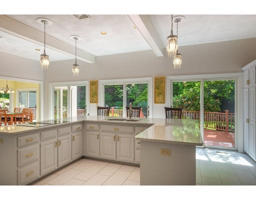 54 Bigelow Drive Sudbury, MA 01776 - Photo 15 of 40 a large kitchen with kitchen island a large counter space a sink appliances and a large window