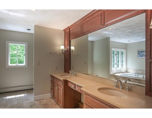 54 Bigelow Drive Sudbury, MA 01776 - Photo 32 of 40 a bathroom with a granite countertop sink a mirror and a