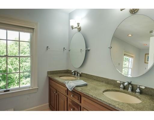 54 Bigelow Drive Sudbury, MA 01776 - Photo 35 of 40 a bathroom with a granite countertop double vanity sink and a mirror