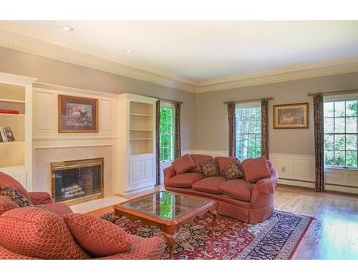 54 Bigelow Drive Sudbury, MA 01776 - Photo 7 of 40 a living room with furniture and a fireplace