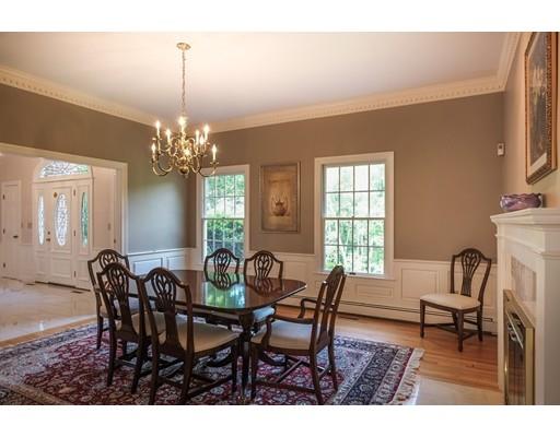 54 Bigelow Drive Sudbury, MA 01776 - Photo 8 of 40 a view of a dining room with furniture and chandelier