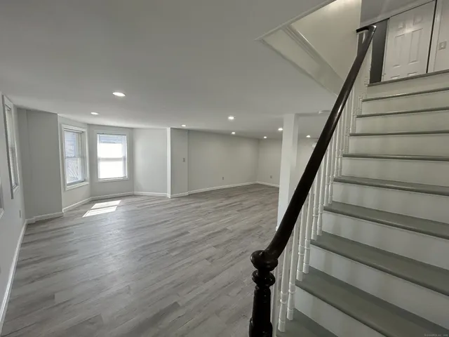 a view of entryway with wooden floor