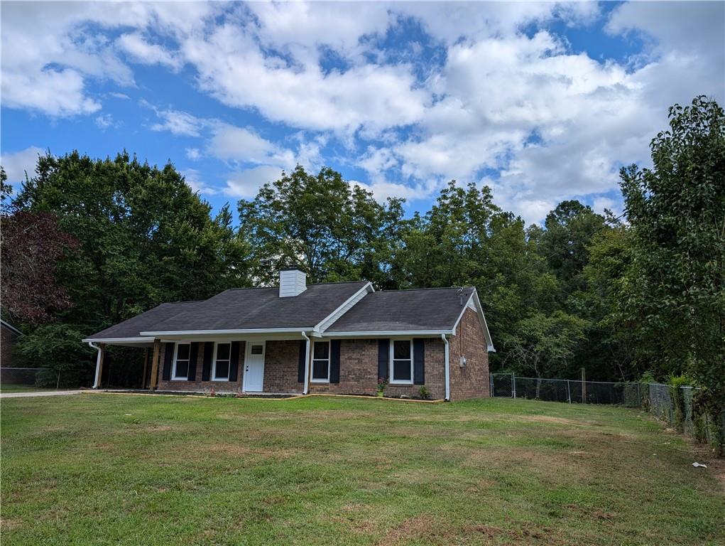 1162 New Rosedale Road Northeast Armuchee, GA 30105 - Photo 1 of 1 a front view of a house with garden