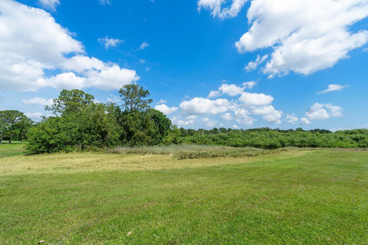 3200 Southeast Downwinds Road Jupiter, FL 33478 - Photo 15 of 28 a view of a big yard with lots of green space
