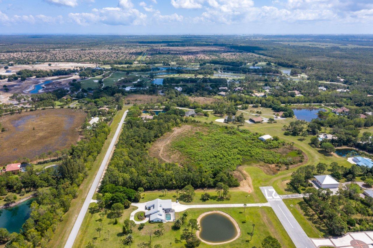 3200 Southeast Downwinds Road Jupiter, FL 33478 - Photo 23 of 28 an aerial view of residential houses with outdoor space