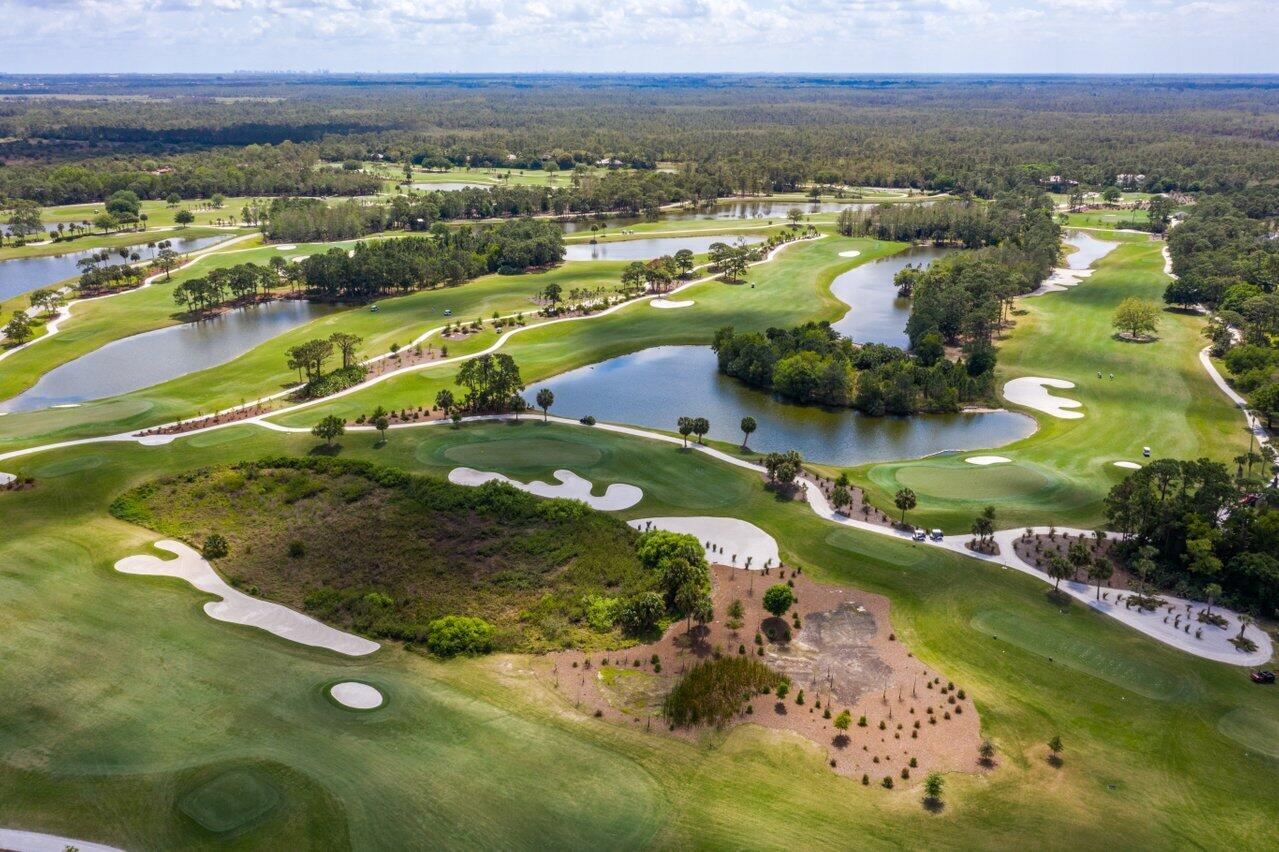 3200 Southeast Downwinds Road Jupiter, FL 33478 - Photo 26 of 28 an aerial view of residential houses with outdoor space