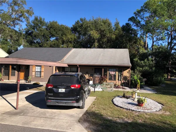a car parked in front of a house