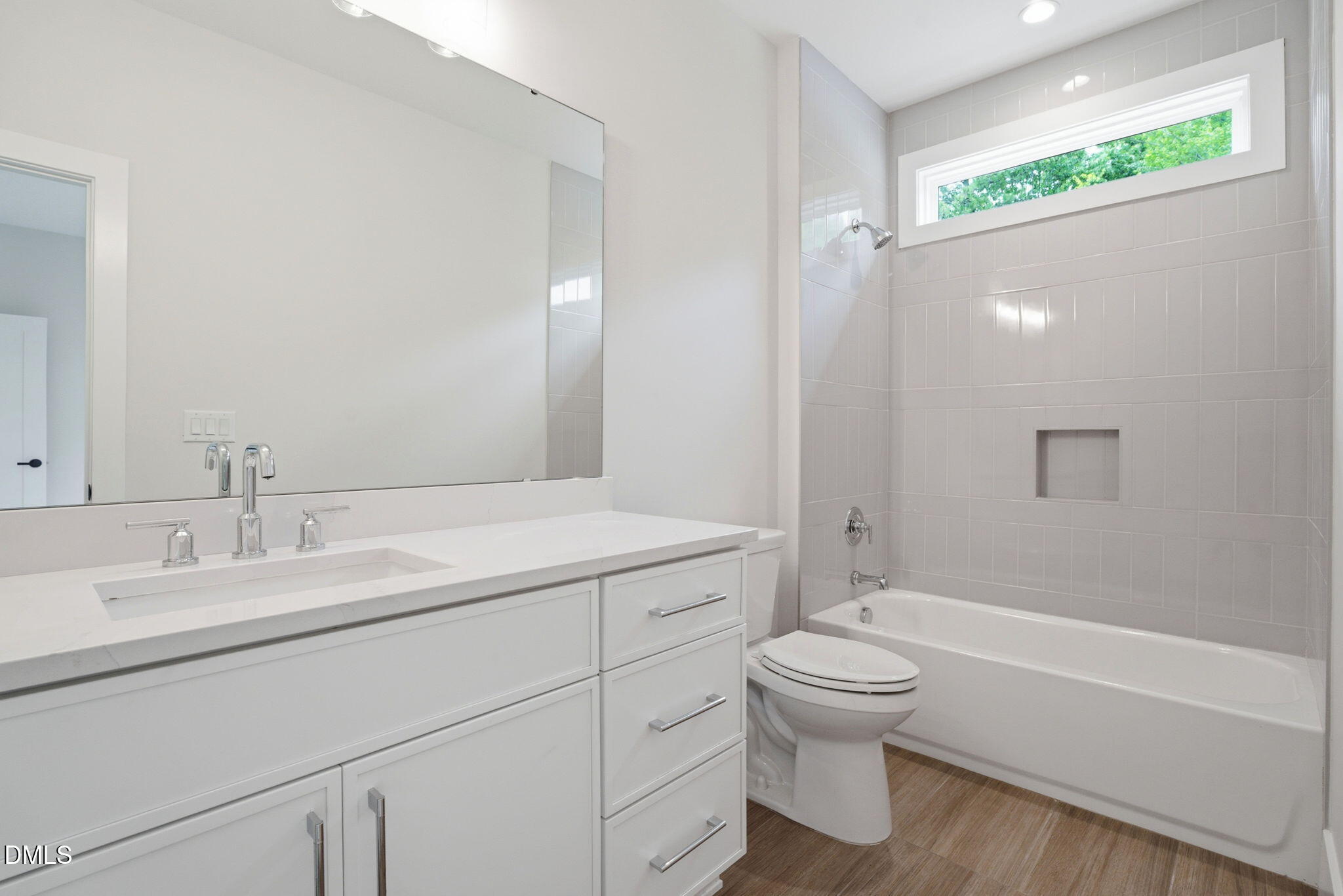 1304 Sanctuary Pond Drive Raleigh, NC 27606 - Photo 34 of 52 a bathroom with a granite countertop sink toilet and shower
