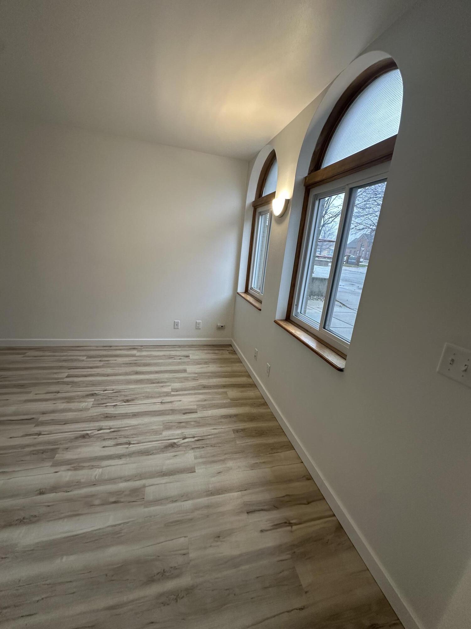 806 Maple Avenue La Porte, IN 46350 - Photo 3 of 9 wooden floor in an empty room with a window